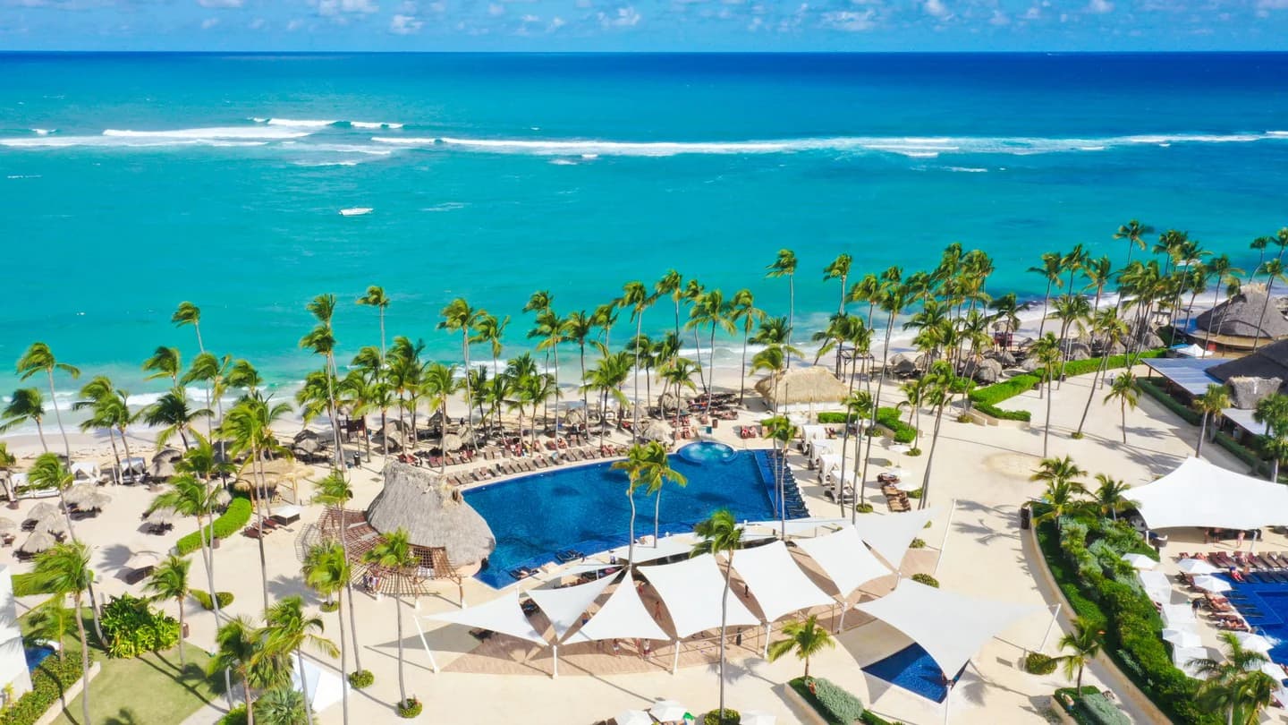 Aerial view of the Royalton Punta Cana beachfront, pools, and turquoise Caribbean water